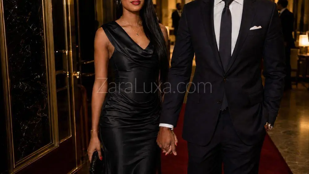 Woman in black satin dress and man in black suit